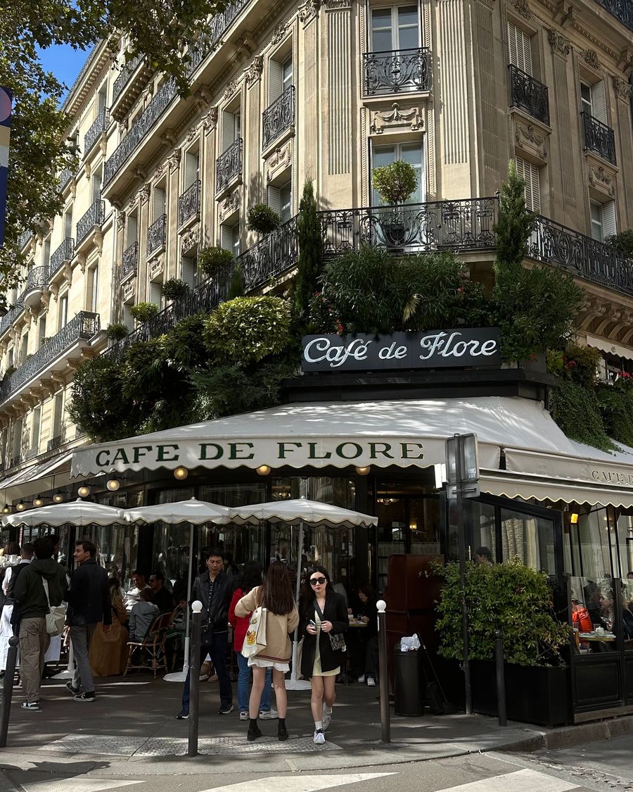 The ivy-covered corner terrace of Café de Flore in Paris