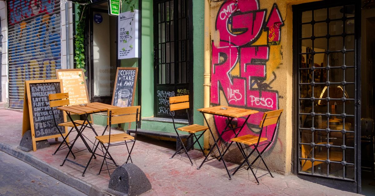 Two empty chairs at a small round café table, making the case for meeting one person at a time